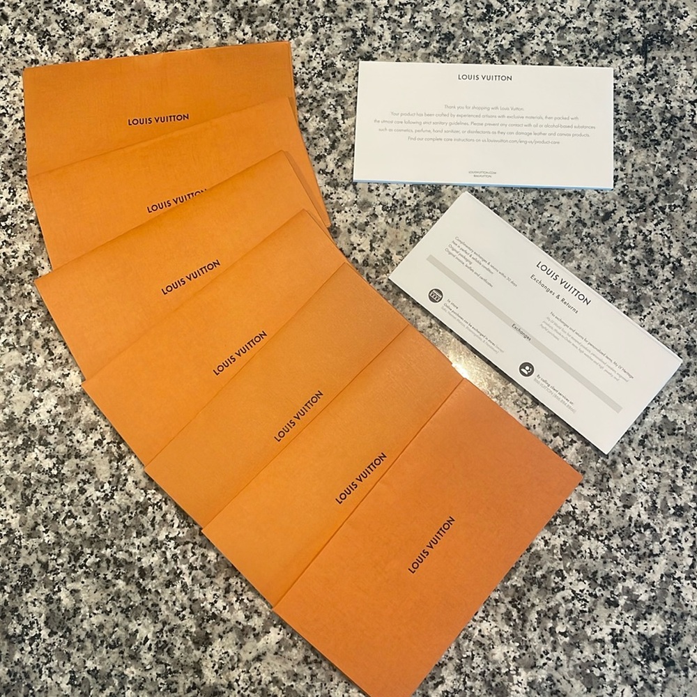 7 large Louis Vuitton Receipt holders with paperwork